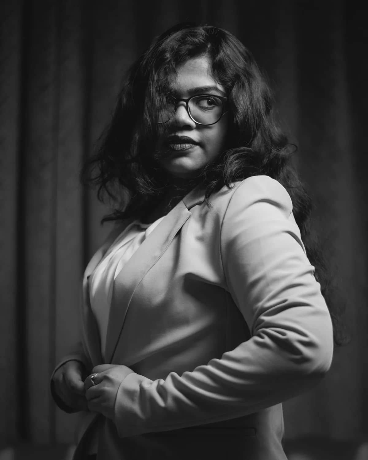 Black and white editorial portrait of Leslie Lewis, Media Planner. STOCK PLACEHOLDER - swap with real team portrait.